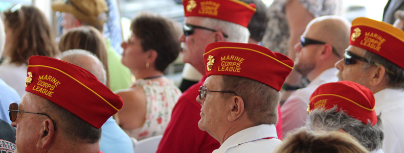 Group of veterans with red hats