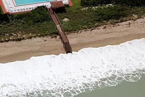 waves hitting steps on the beach