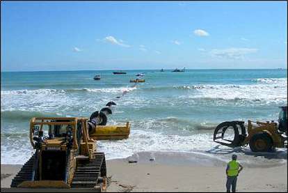 Bulldozers on the beach