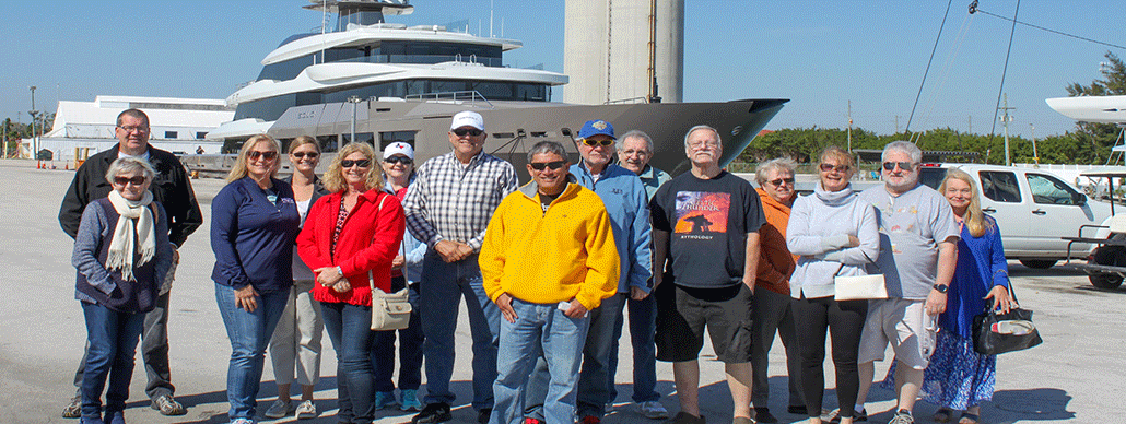 Citizens Academy members in front of yacht at Port of Fort Pierce