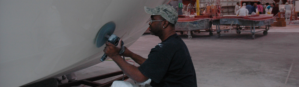 Maverick Boat Employee sanding