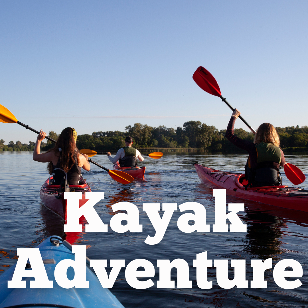 youngsters in kayaks on a river