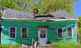 Dilapitated house with caved in roof