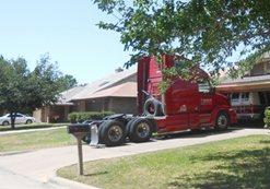 large commercial truck in driveway of home