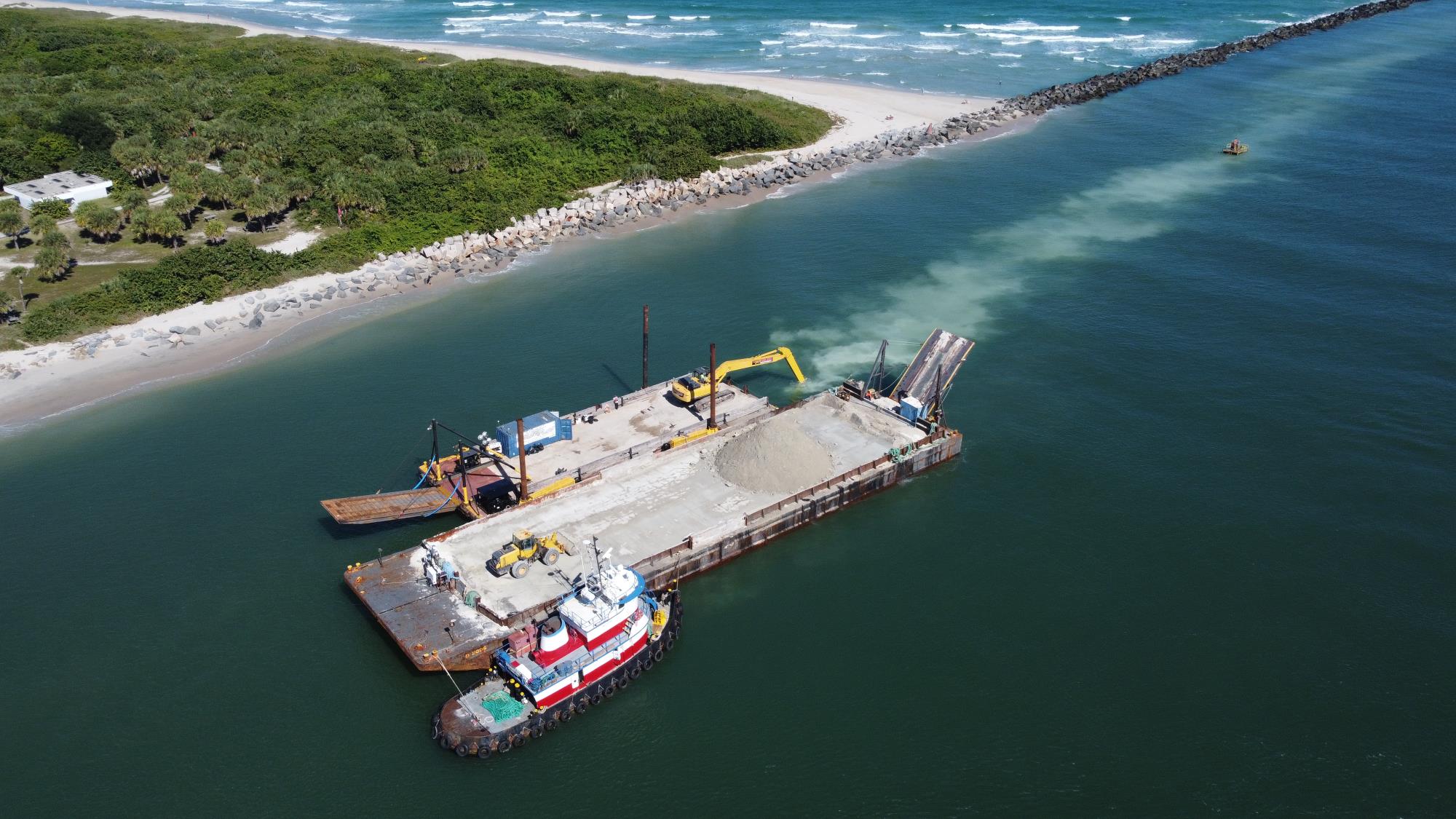 Barge  with sand on water